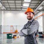 Modern, clean industrial workspace with tools and painting equipment, set against a professional Perth backdrop, optimal for a featured image in the 16:9 aspect ratio.