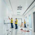 Professional painters refresh a healthcare facility with a modern, clean look, enhancing the patient experience.